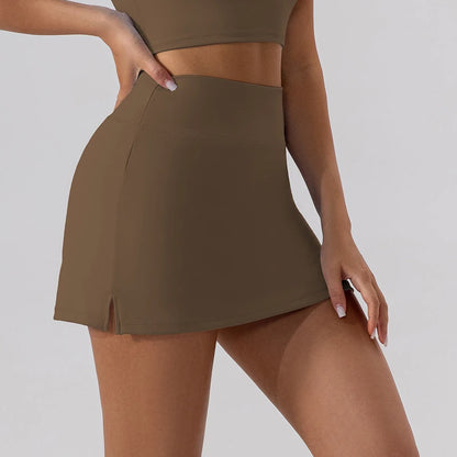 Close-up of a brown high-waist athletic tennis skirt with a small side slit.