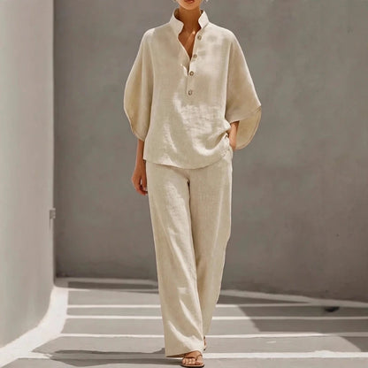 Woman wearing a beige two-piece outfit with a button-front tunic and matching wide-leg pants