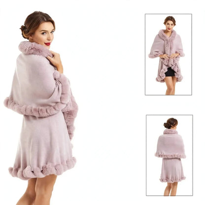 Woman wearing a dusty pink double layer poncho with fluffy faux fur trim on collar and hem, side view.