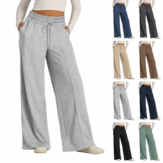Light gray wide-leg fleece pants with drawstring waist and center-seam detail, worn with white top and sneakers