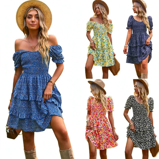 Woman wearing off-shoulder blue floral mini dress with tiered ruffles and straw hat.