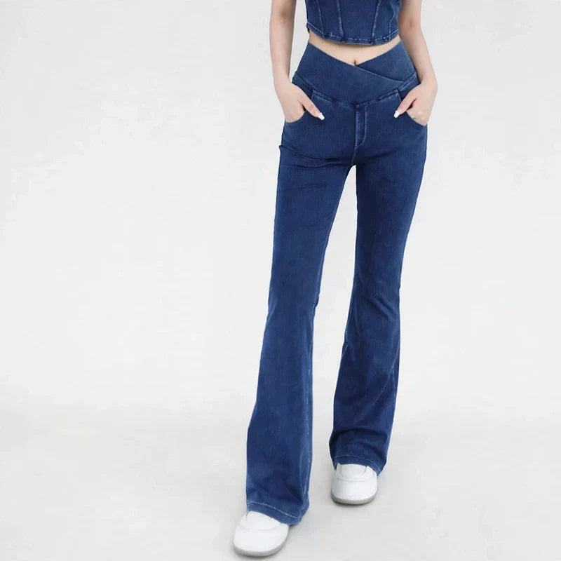 Dark wash bell bottom jeans with a crisscross high waist and front pockets