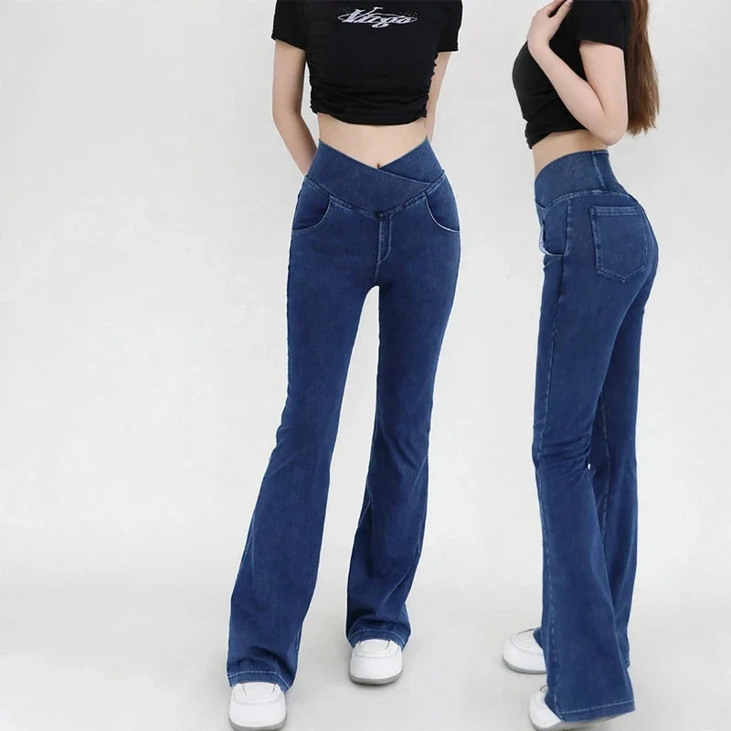 Front and side views of dark blue high-waist bell-bottom jeans with a crossover waistband.