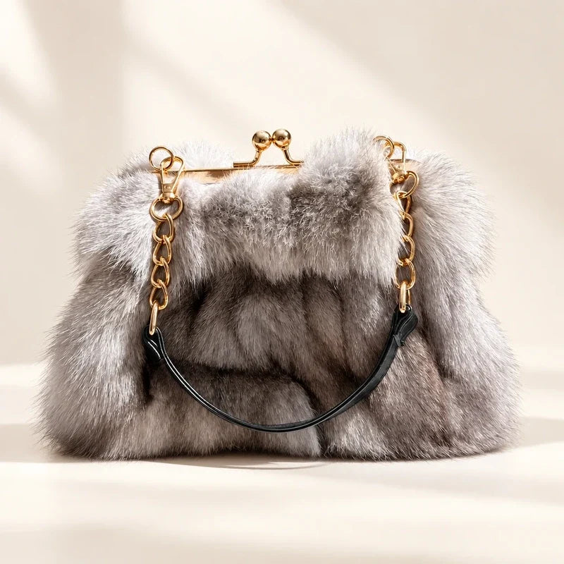 Fluffy grey fur evening handbag with a gold-tone kiss-lock frame and chain handle.
