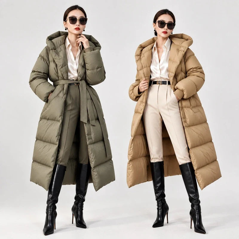 Two models wearing long hooded puffer coats in olive green and beige with boots.