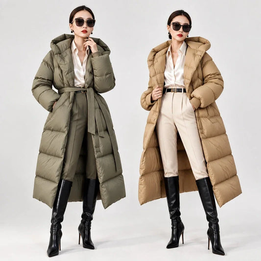 Two models wearing long hooded puffer coats in olive green and beige with boots.