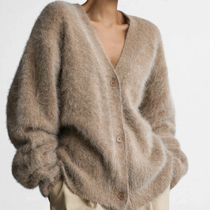 Tan fuzzy oversized V-neck button cardigan sweater with dropped shoulders.