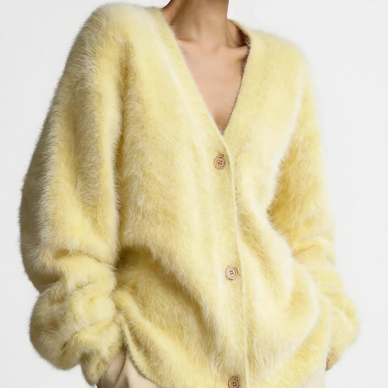 Yellow fuzzy V-neck button-front cardigan sweater with long sleeves.