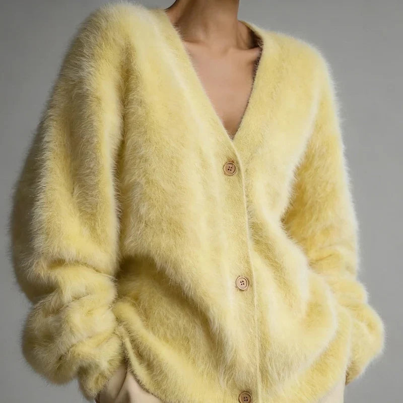 Yellow fuzzy V-neck button-down cardigan with long sleeves.