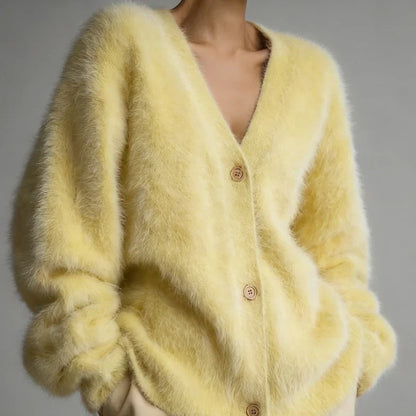 Yellow fuzzy V-neck button-down cardigan with long sleeves.
