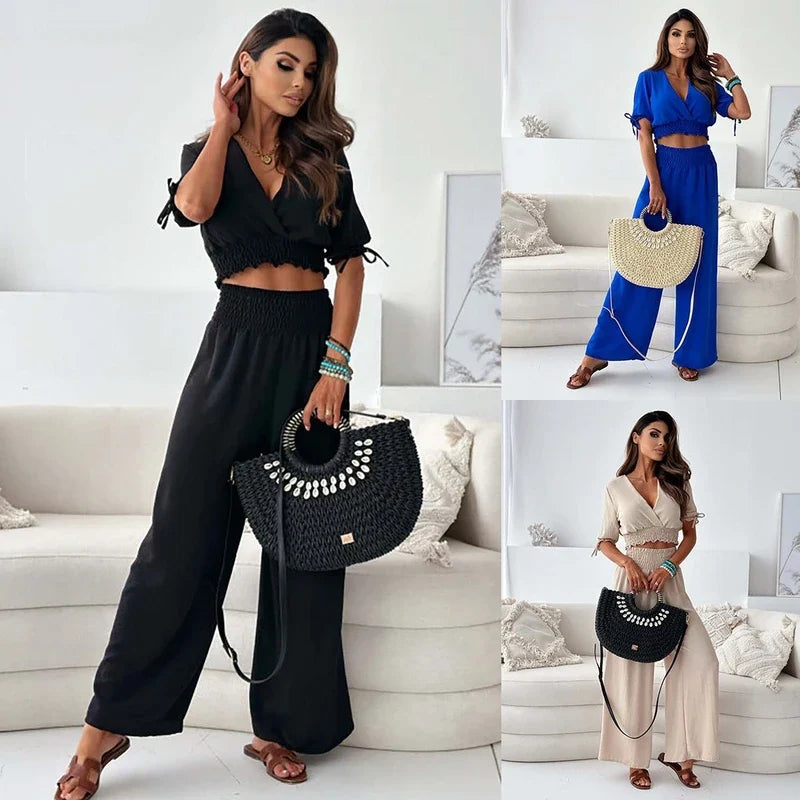 Model wearing a short-sleeve crop top and wide-leg pant set, shown in black, blue, and beige.
