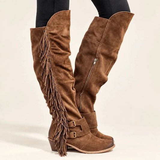 Brown suede over-the-knee boots with side fringe and double buckled ankle straps.