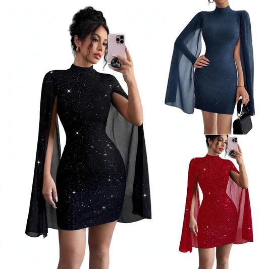 Model wearing a black glitter mini dress with sheer cape sleeves, holding a phone.
