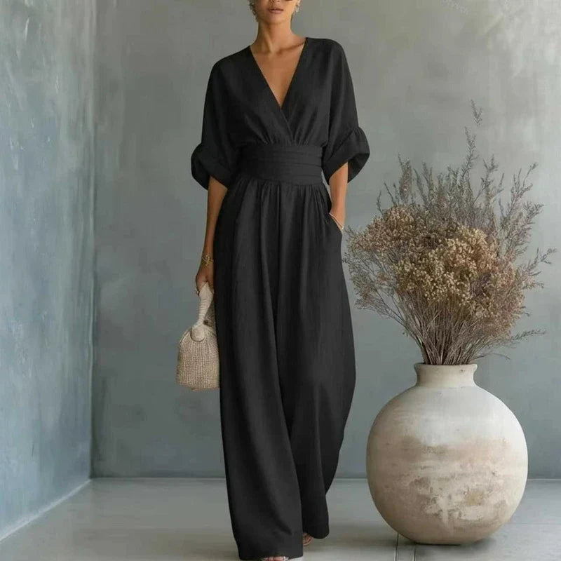 Alternate view of Women's tailored jumpsuit with a V-neck, wide leg, and waist sash
