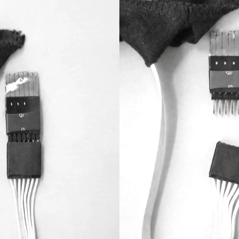 Close-up of LED shirt wiring harness and connector pins.