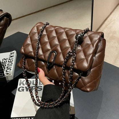 Women's quilted shoulder bag with diamond quilting and a chain strap