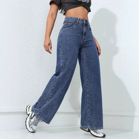 Dark wash high-waisted wide-leg baggy jeans worn with a black crop top and sneakers.