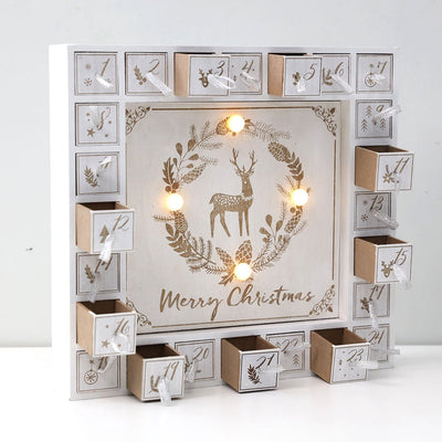 Wooden advent calendar house with LED lights and 24 drawers